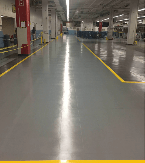 Conductive coating over standard floor tiles to protect robots from ESD